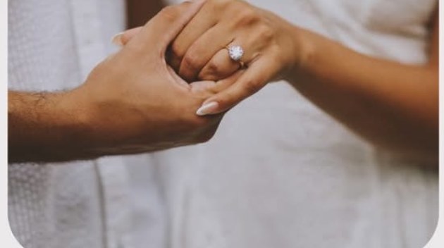 The ring — hands together